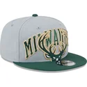 lippikset-littea-harmaa-snapback-9fifty-tip-off-2023-milwaukee-bucks-nba-new-era
